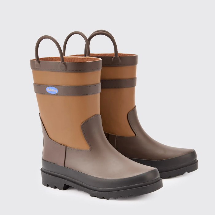 Pair of brown and beige rubber boots on a light grey background