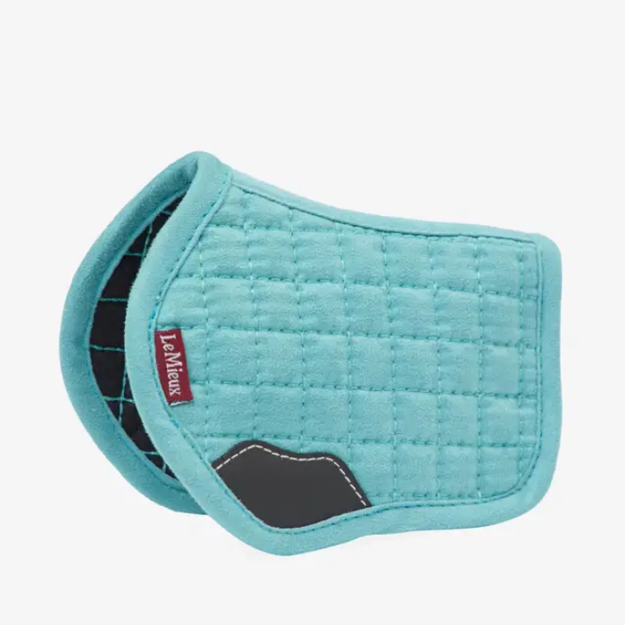 Turquoise blue saddle pad to suit a toy pony on a white background