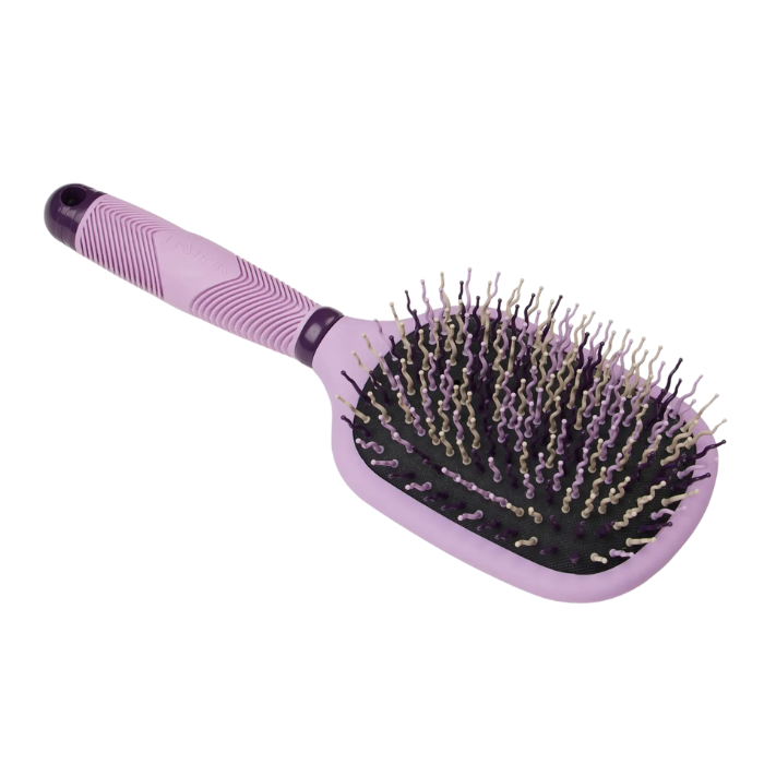 Purple horse grooming brush with black bristles on a white background
