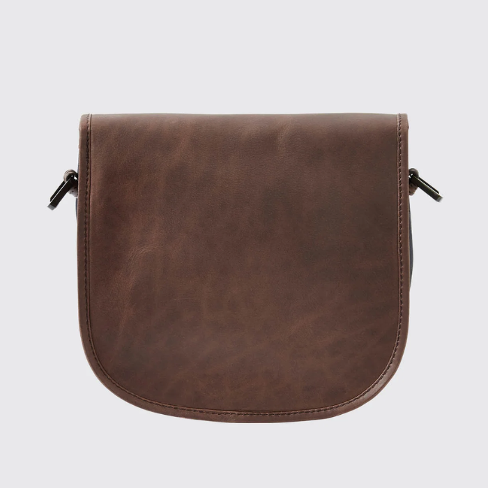 Brown leather bag on a light grey background