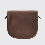 Brown leather bag on a light grey background