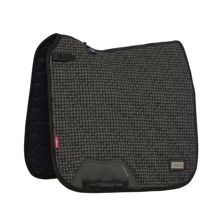 Grey and black patterned saddle pad with brand logo on a white background