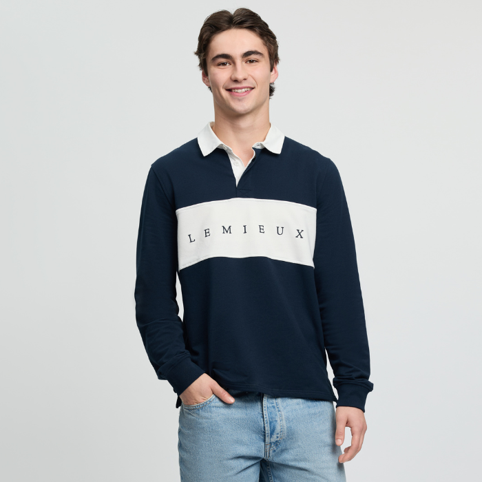 Man wearing a navy and white rugby shirt with 'LEMIEUX' branding on a light grey background