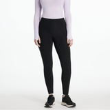 Person wearing black leggings and a light purple long-sleeve top on a white background