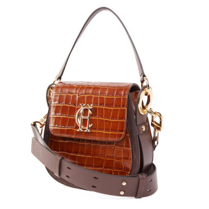 Brown leather handbag with gold accents on a white background