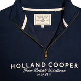 Navy blue pullover with 'Holland Cooper' branding on a white background