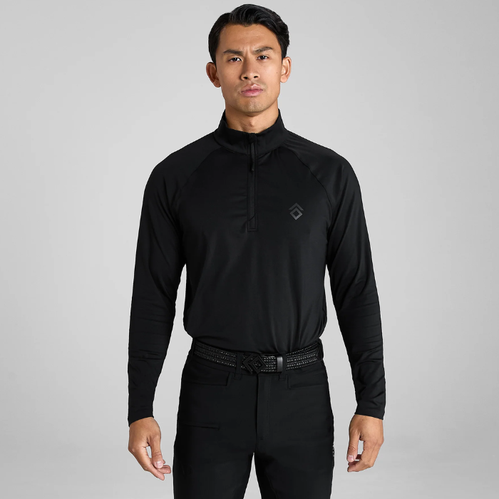 Man wearing a black long-sleeve shirt with a collar on a grey background