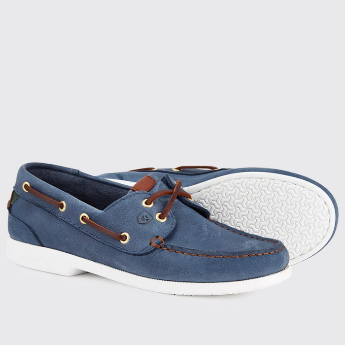 Blue suede boat shoe with white sole on a light grey background