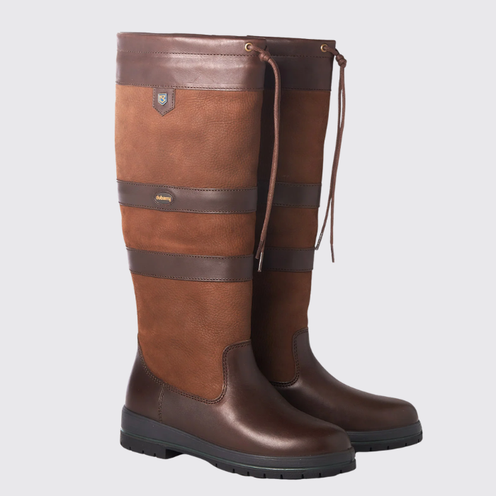 Pair of brown leather country boots on a grey background