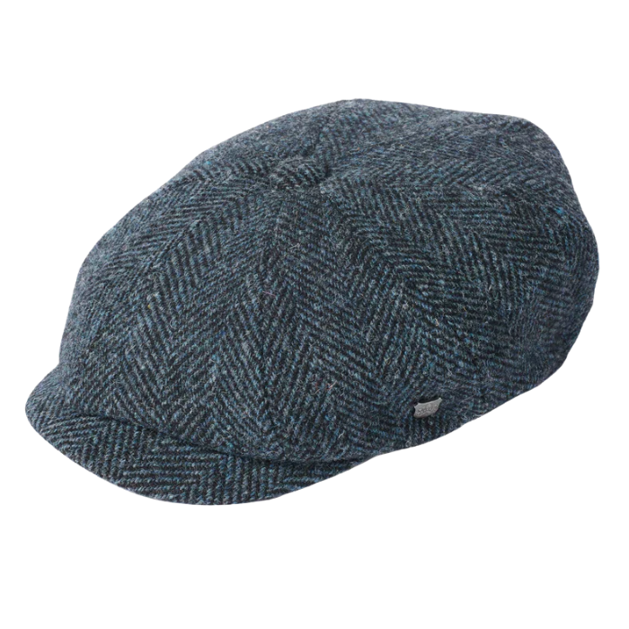 Blue tweed cap on a white background
