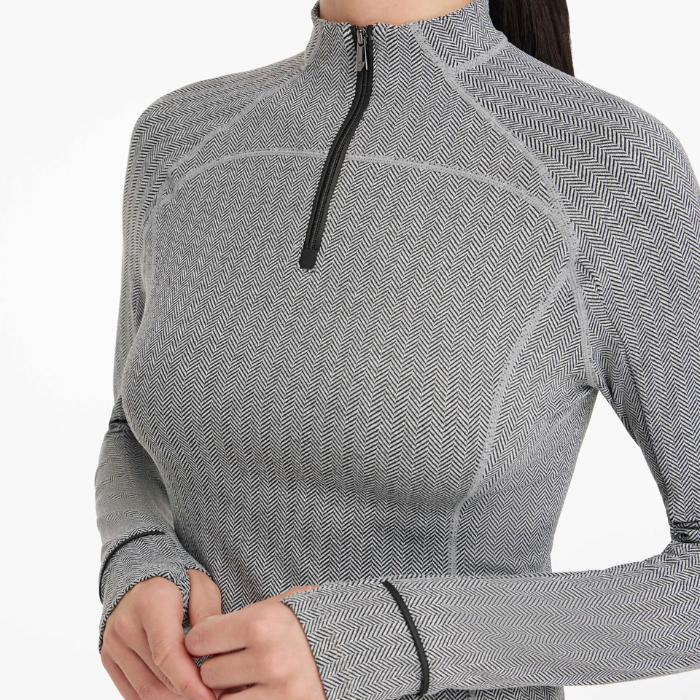 Grey long-sleeve base layer with a quarter zip on a white background