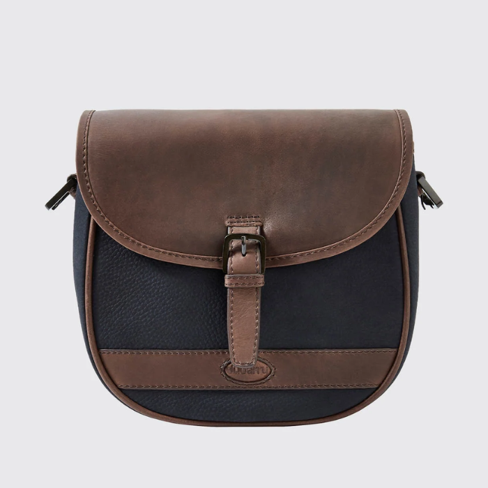 Brown and black leather bag with a buckle on a light grey background