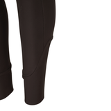 Tapered cuff of a pair of riding tights on a white background