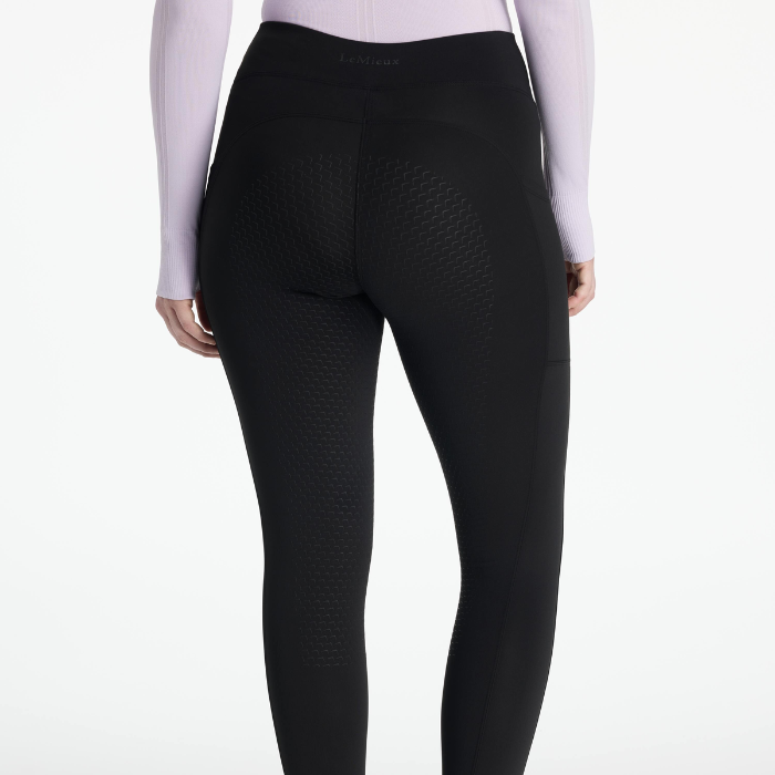 Black leggings worn by a person on a white background