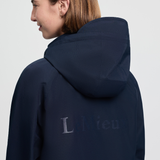 Close-up of LeMieux branding on a navy waterproof jacket with a white background