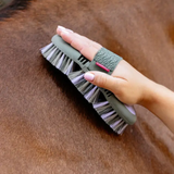 Lilac grooming brush being used on a horse's coat