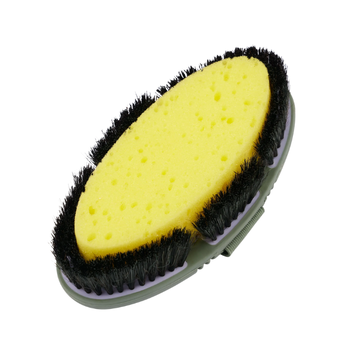 Yellow sponge with black bristles on a white background