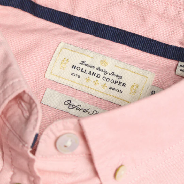 Close-up of a pink shirt with 'Holland Cooper' label
