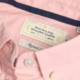 Close-up of a pink shirt with 'Holland Cooper' label