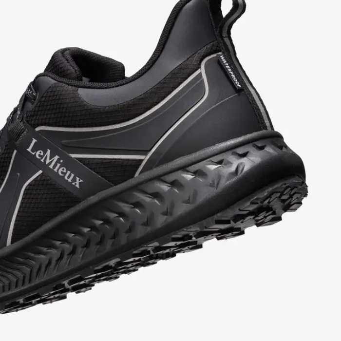 Black equestrian boot with 'LeMieux' branding on a white background