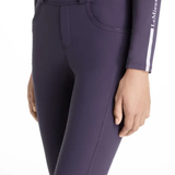 Purple riding leggings with a visible brand logo on a white background