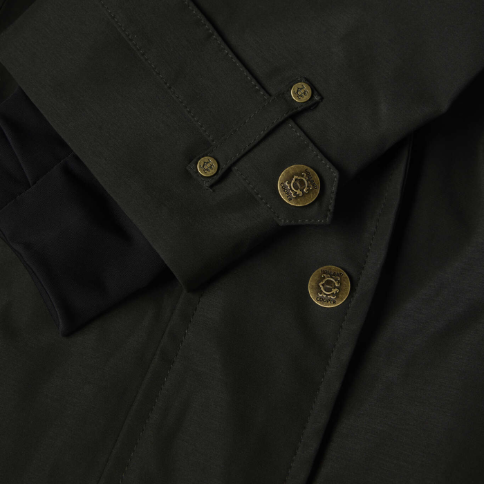 Close-up of a dark green coat with brass buttons on a dark background
