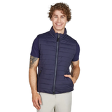 Man wearing a navy puffer gilet on a white background