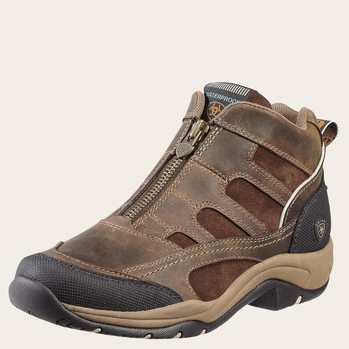 Brown hiking boot with a visible brand logo on a white background