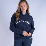 Person wearing a navy blue sweatshirt with 'BLACKFORT' branding on a light grey background