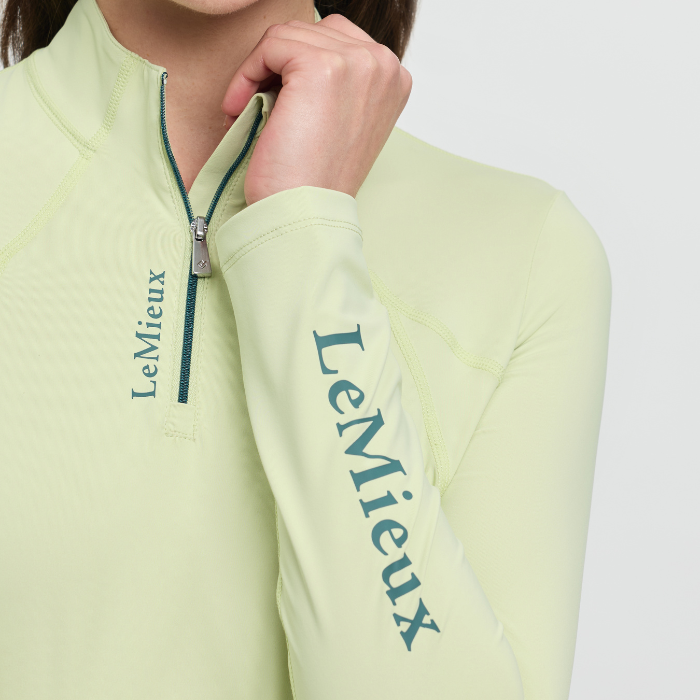 Light yellow active top with 'LeMieux' branding on a white background