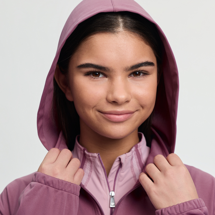 Person wearing a purple hood against a plain background