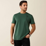 Man wearing a green t-shirt with a logo on a beige background