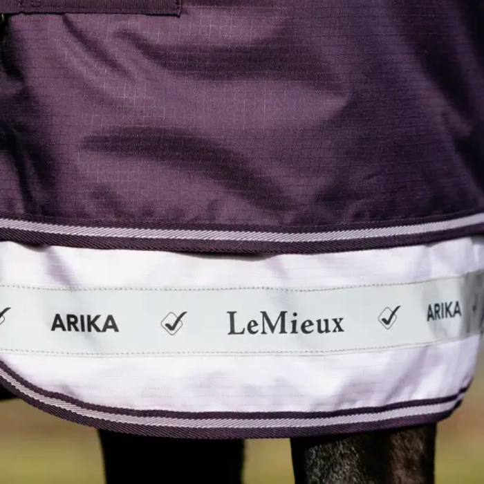 Purple material with a reflective strip and LeMieux ARIKA branding