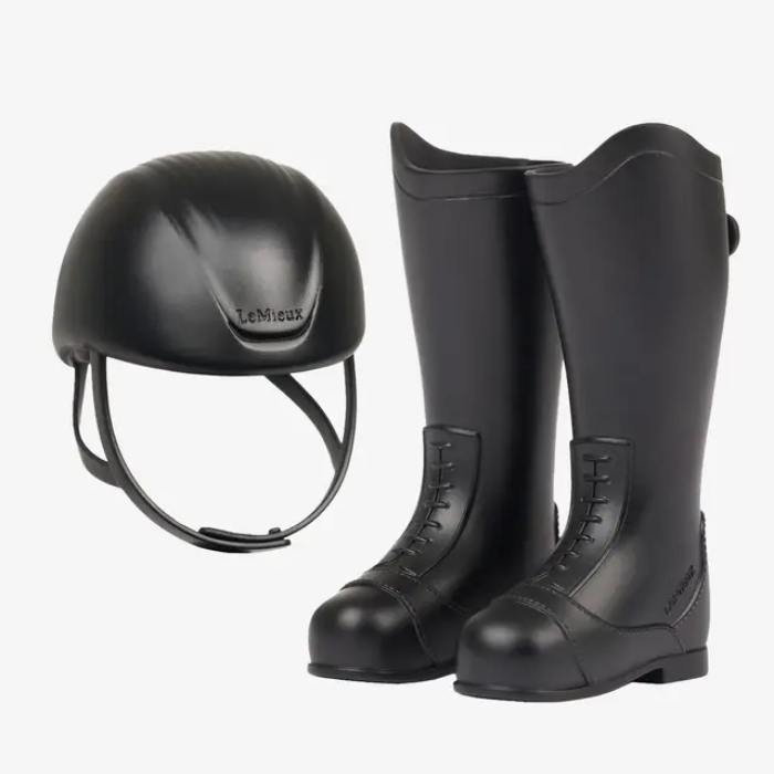 Black equestrian helmet and boots on a white background