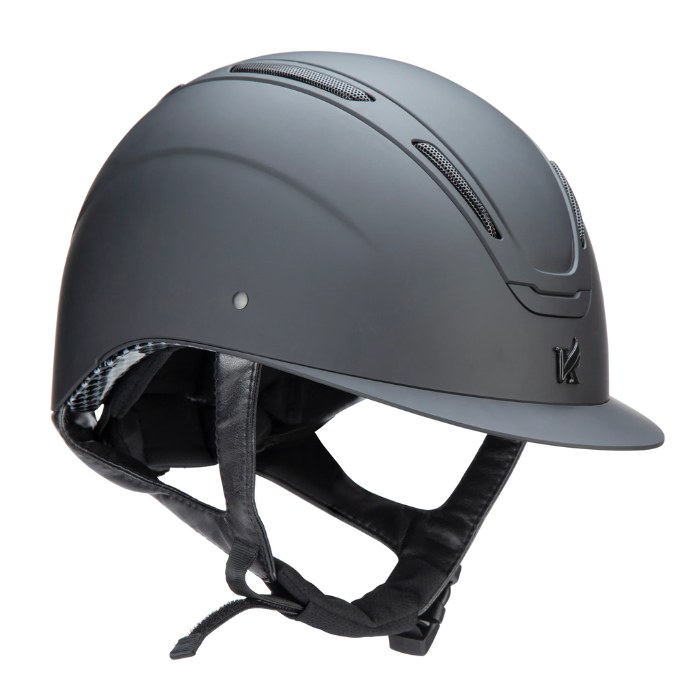 Black riding helmet with black chin strap on a white background