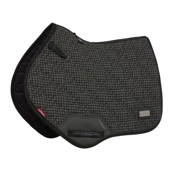 Grey houndstooth patterned saddle pad with black accents on a white background