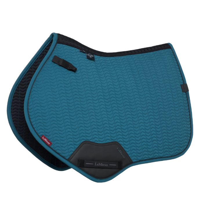 Teal saddle pad with black accents on a white background