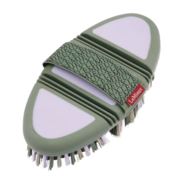 Lilac grooming brush on a white background