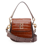 Brown ladies handbag with HC logo detail on a white background