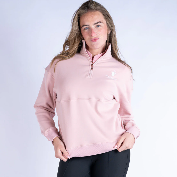 Person wearing a pink pullover with a white background