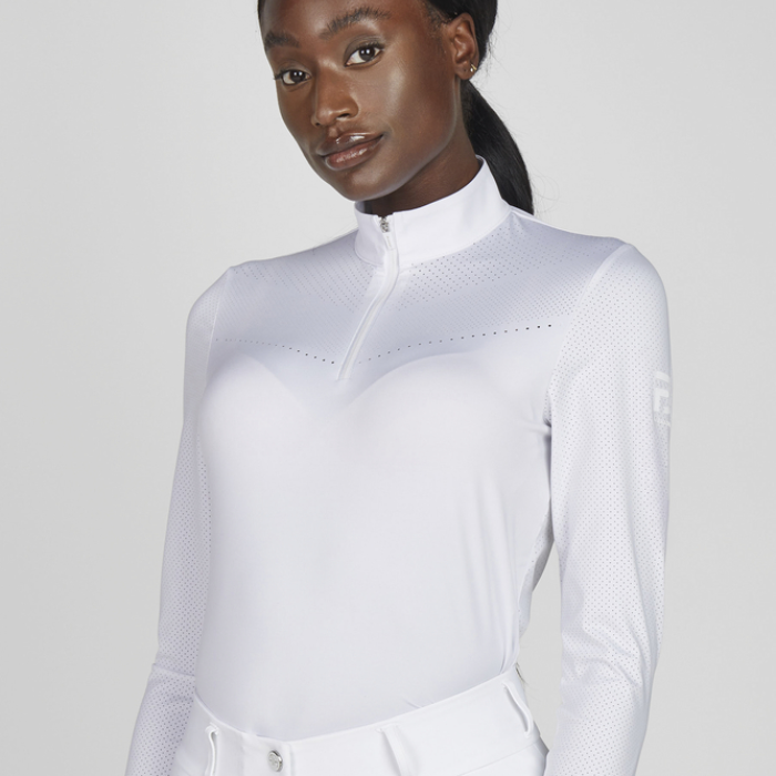 Long sleeved white show shirt on a plain background