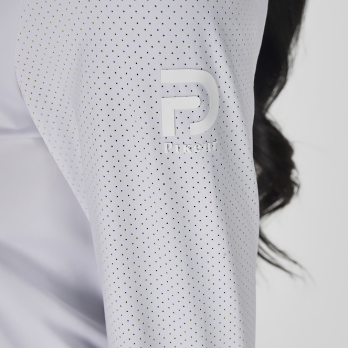Close-up of a white sleeve with a logo, blurred background
