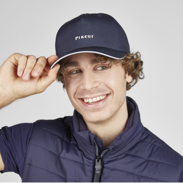 man in blue cap on white background