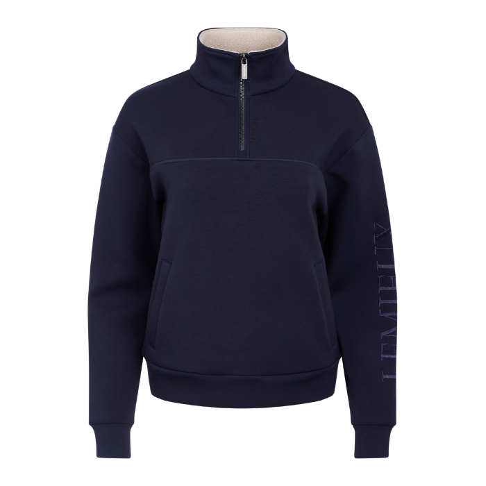 LeMieux AW26 Scarlet Quarter Zip Sweat Variant Colour Navy.
A quarter-zip sweatshirt with a high stand-up collar, side pockets, and vertical branding text on the right sleeve, shown against a plain white background.