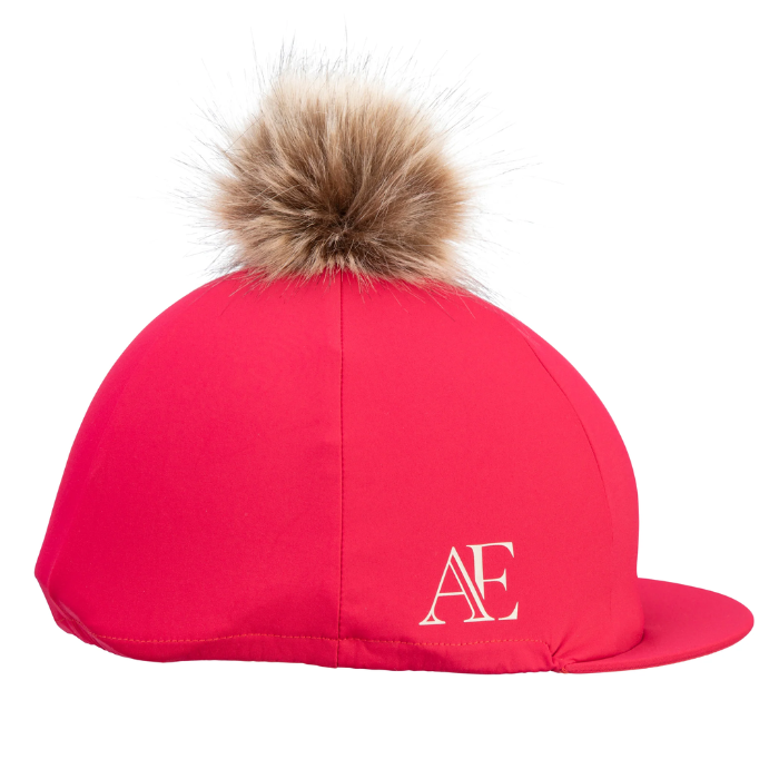 Red cap with a fur pom-pom on a white background