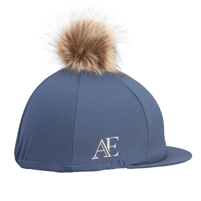 Blue riding hat with a fur pom-pom on a white background