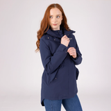 Woman wearing a navy blue jacket on a white background