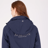 Person wearing a navy blue jacket with 'Aubrion Equestrian' branding on a white background