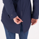 Person wearing a navy blue jacket with a zipper, on a white background