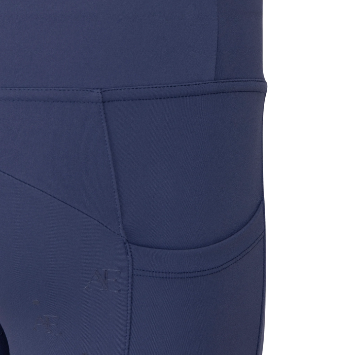Close-up of a blue athletic outfit with a brand logo on a white background